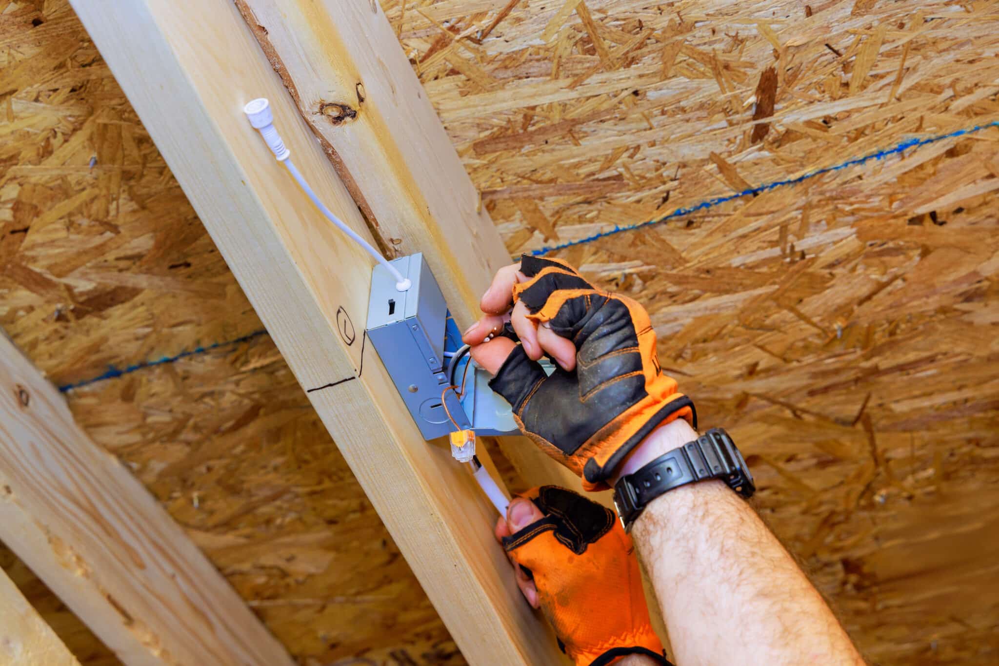 Electrician installing power junction box, Uncovered Junction Boxes.